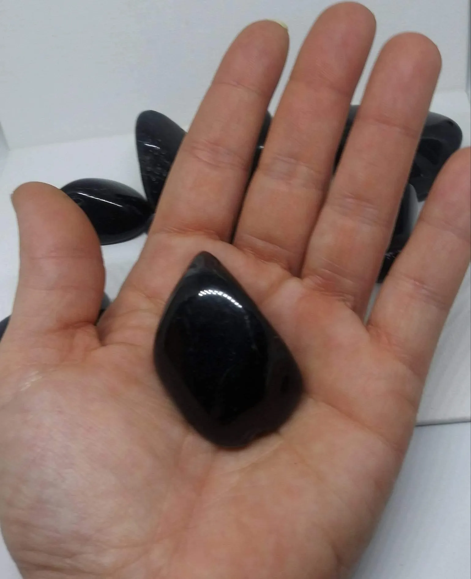 Black Onyx Natural Madagascar Mined tumbled with info card