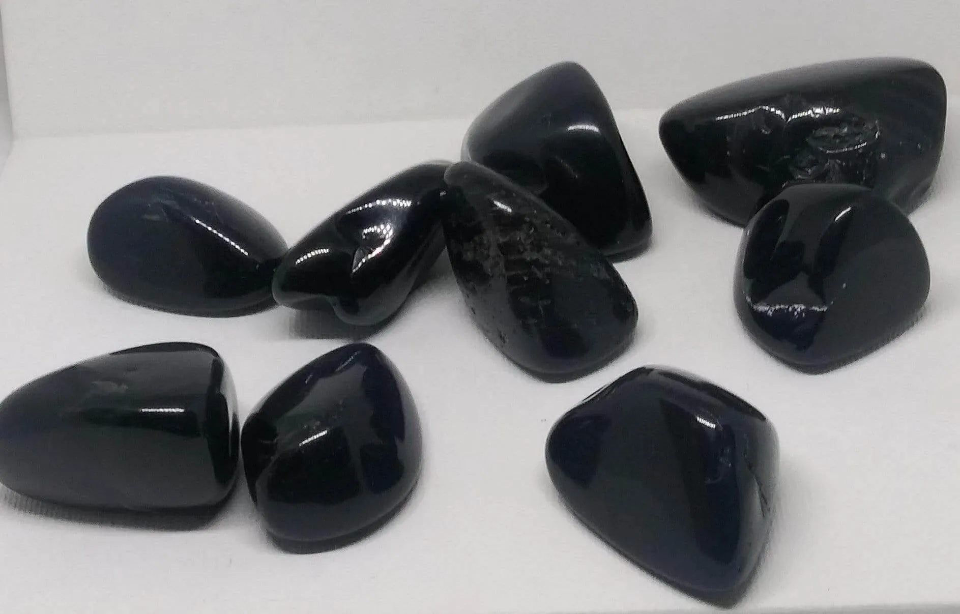 Black Onyx Natural Madagascar Mined tumbled with info card