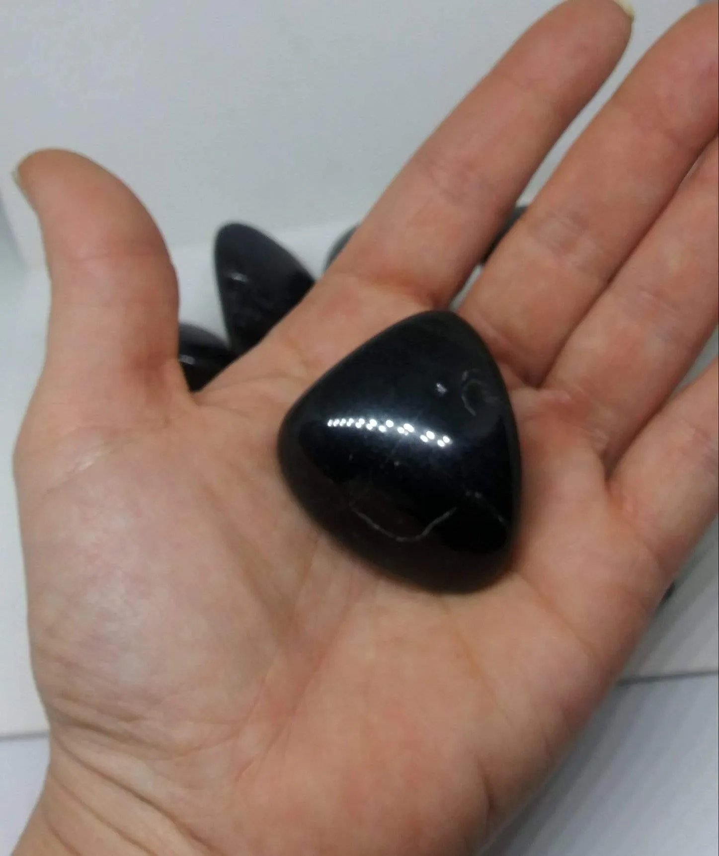 Black Onyx Natural Madagascar Mined tumbled with info card